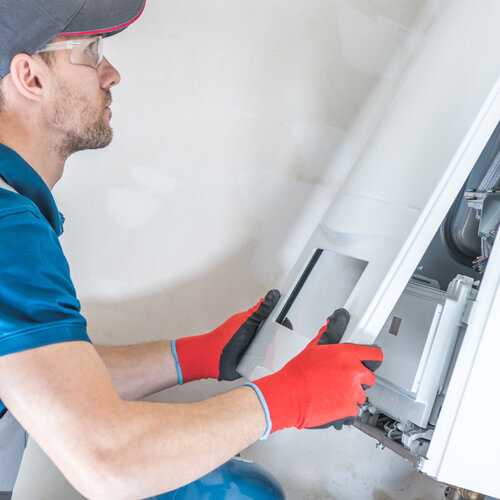 technician working on a heating system