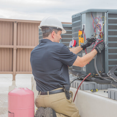 technician providing condenser motor replacement