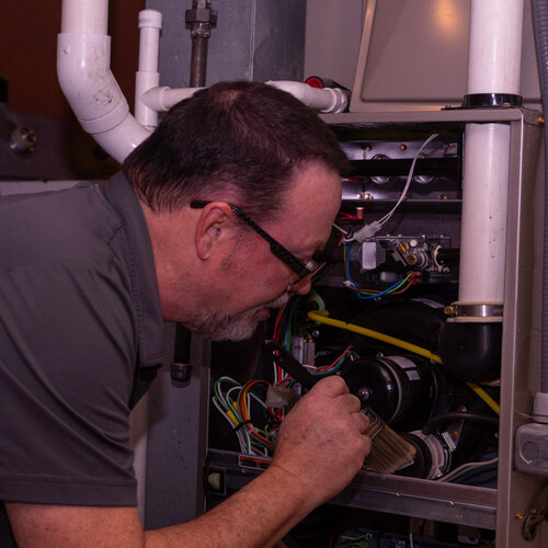 HVAC tech providing gas furnace repair