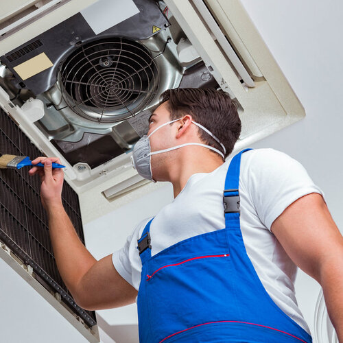 worker providing ac compressor repair